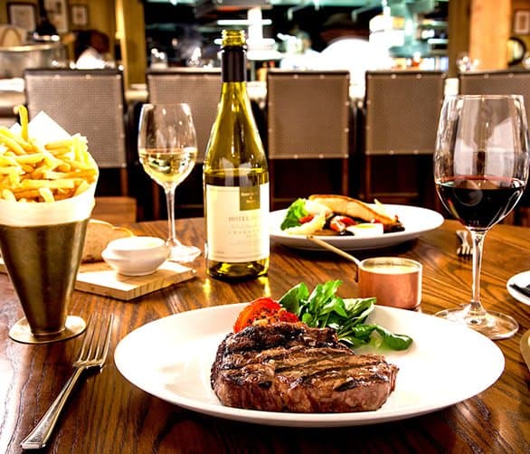 A restaurant table set for a meal