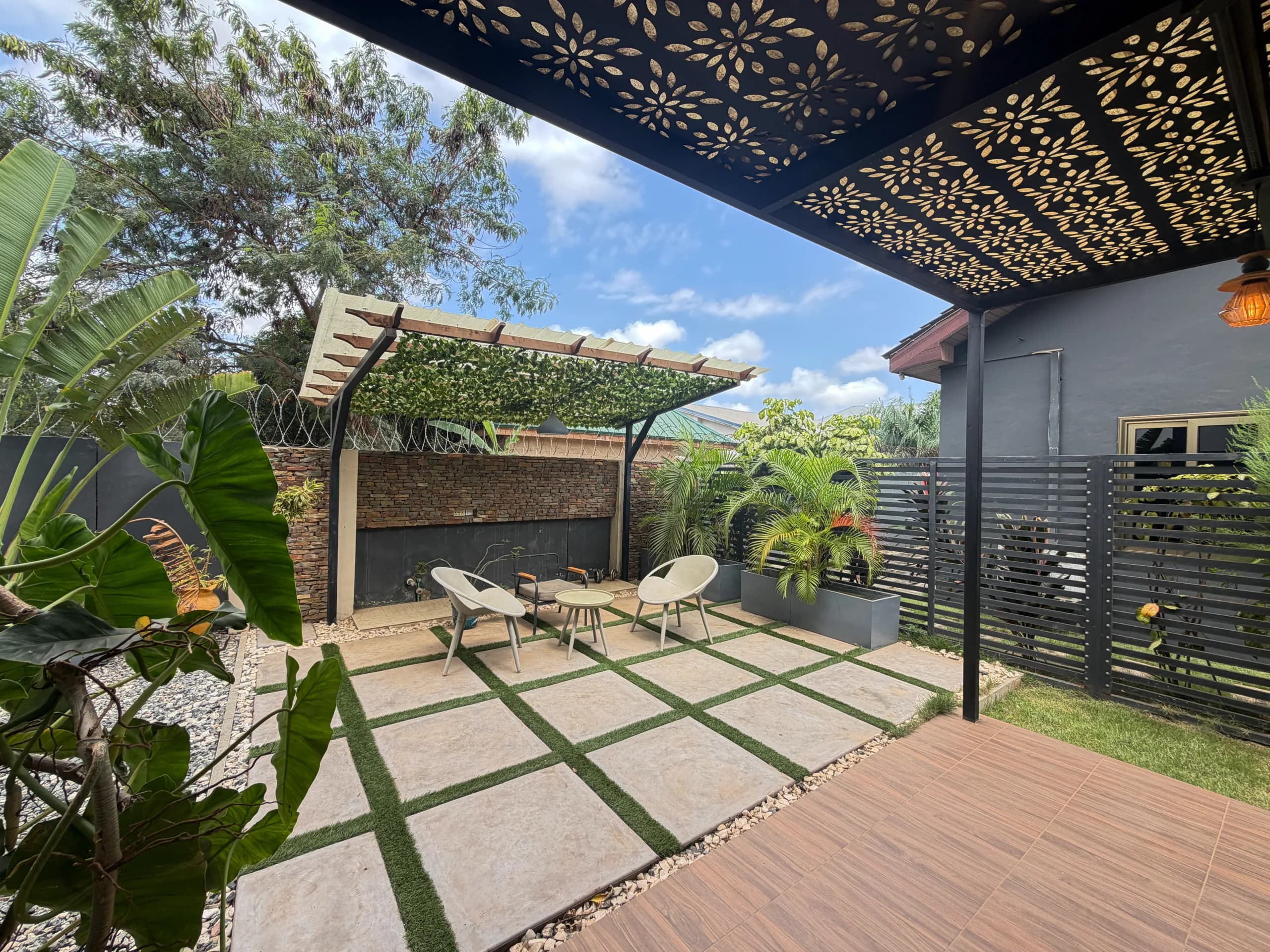 Seating and planting under the terrace canopy