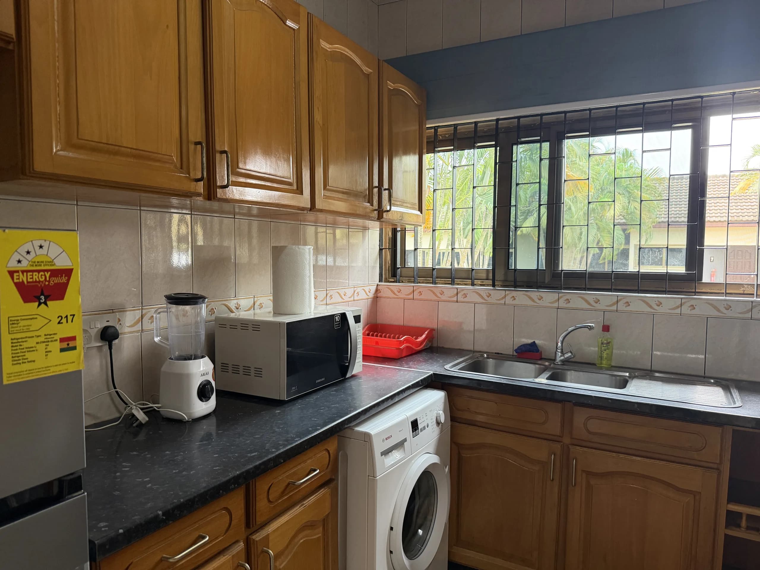 A kitchen with a window over the sink
