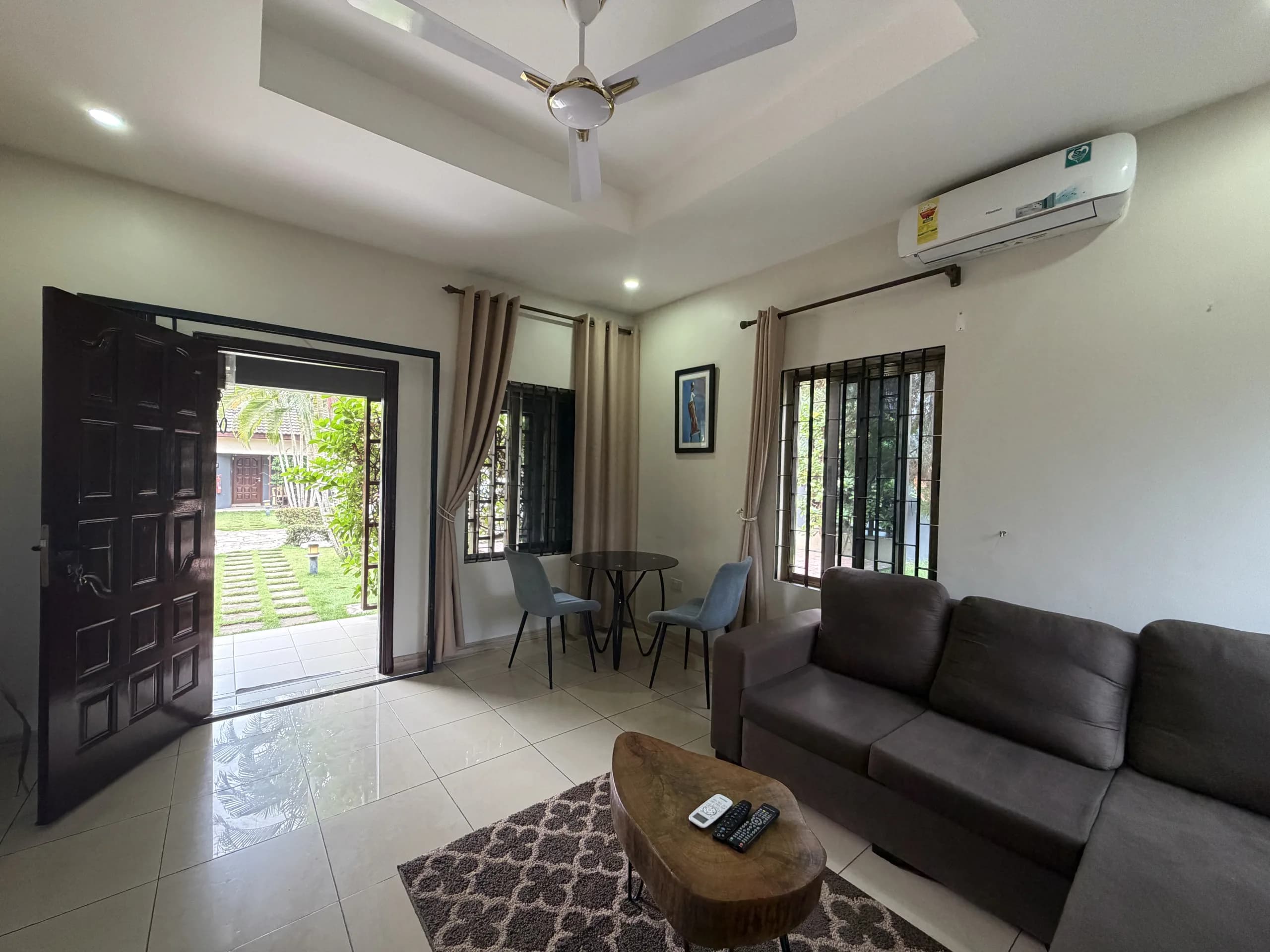 A living room with its doors open onto the garden